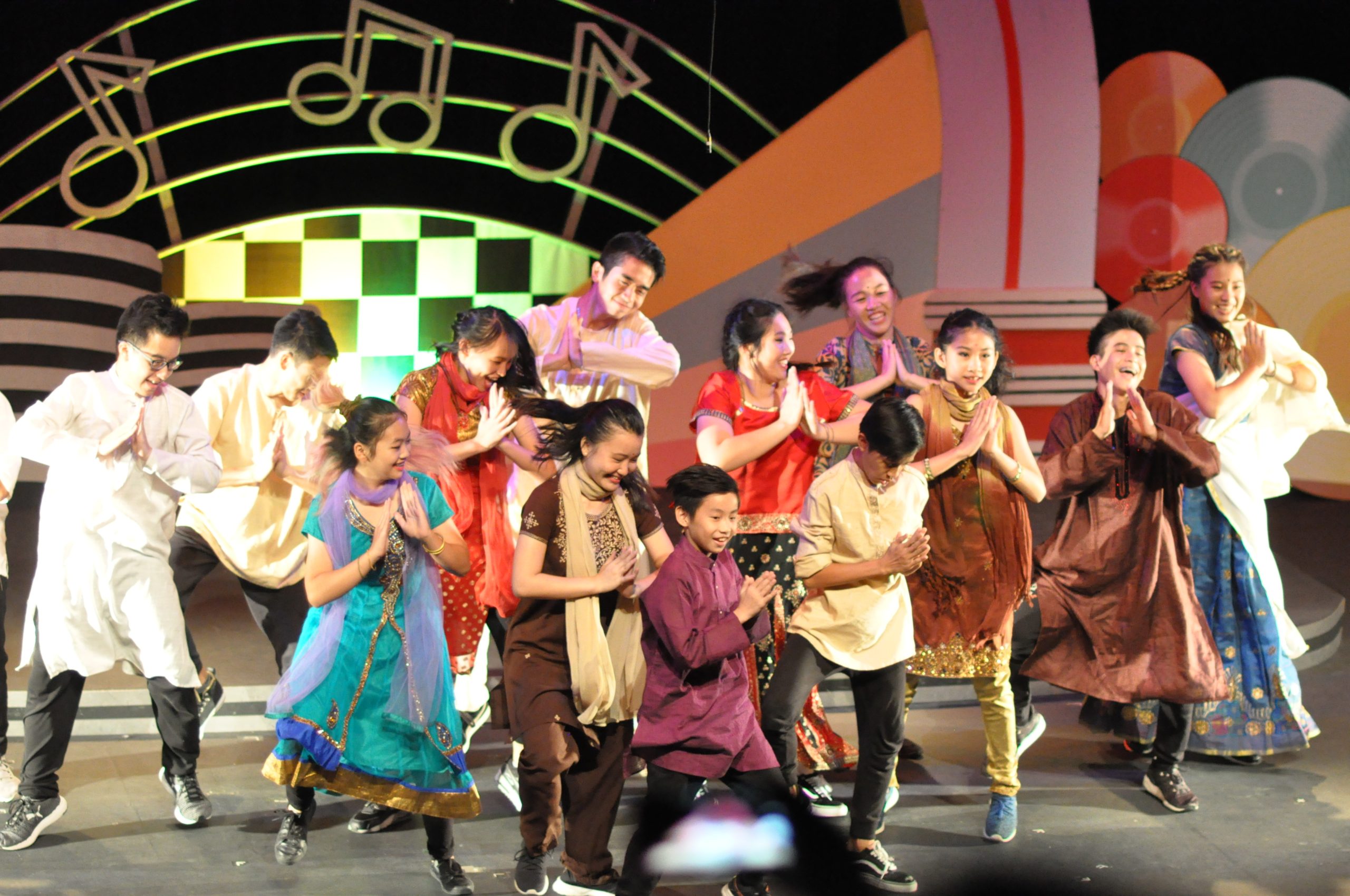 Students from dance class performing on stage in Sri Emas International School.