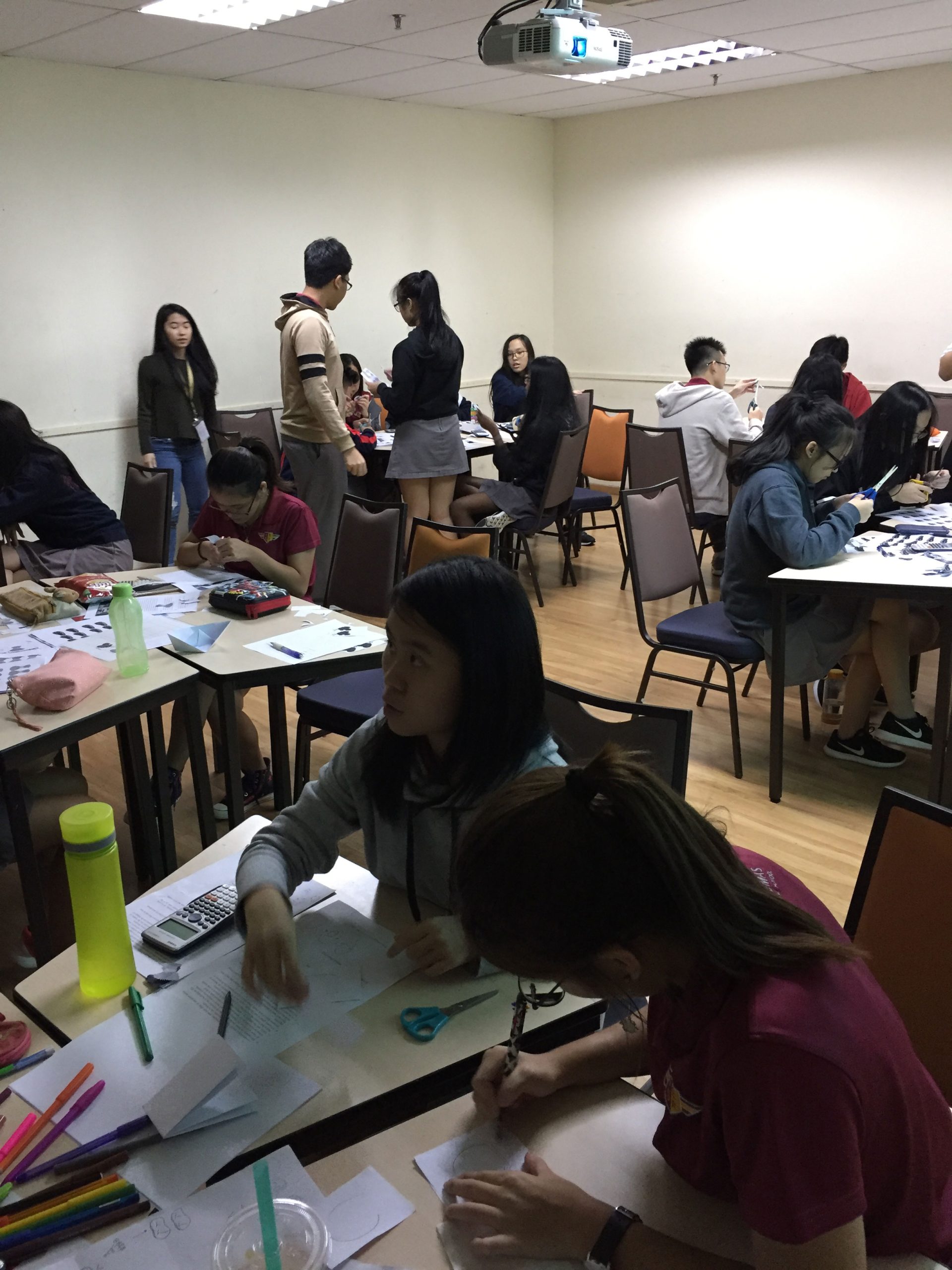 Sri Emas International School Upper secondary students using experiential learning in Economics class to learn about economic principles.