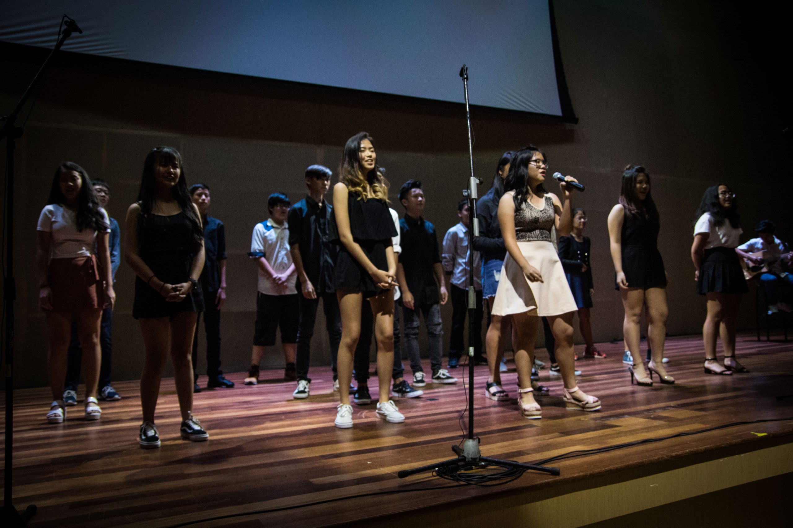 Students from vocal class performing on stage in Sri Emas International School.